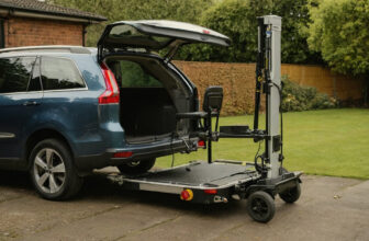 SUV parked on a driveway with an exterior powered lift platform at the rear for carrying a mobility scooter