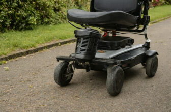 Compact folding mobility scooter on a paved path