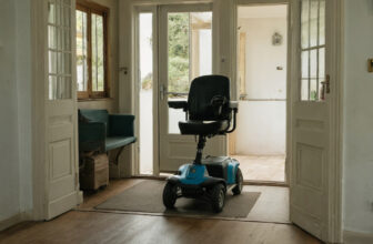 Mobility scooter passing through a widened interior doorway in a home